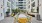 long table outdoors with yellow chairs